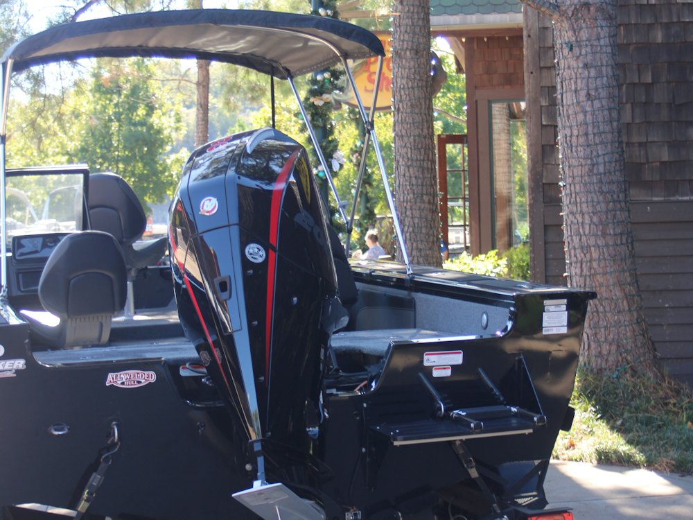 Boat with an outboard engine on a trailer (stock photo)